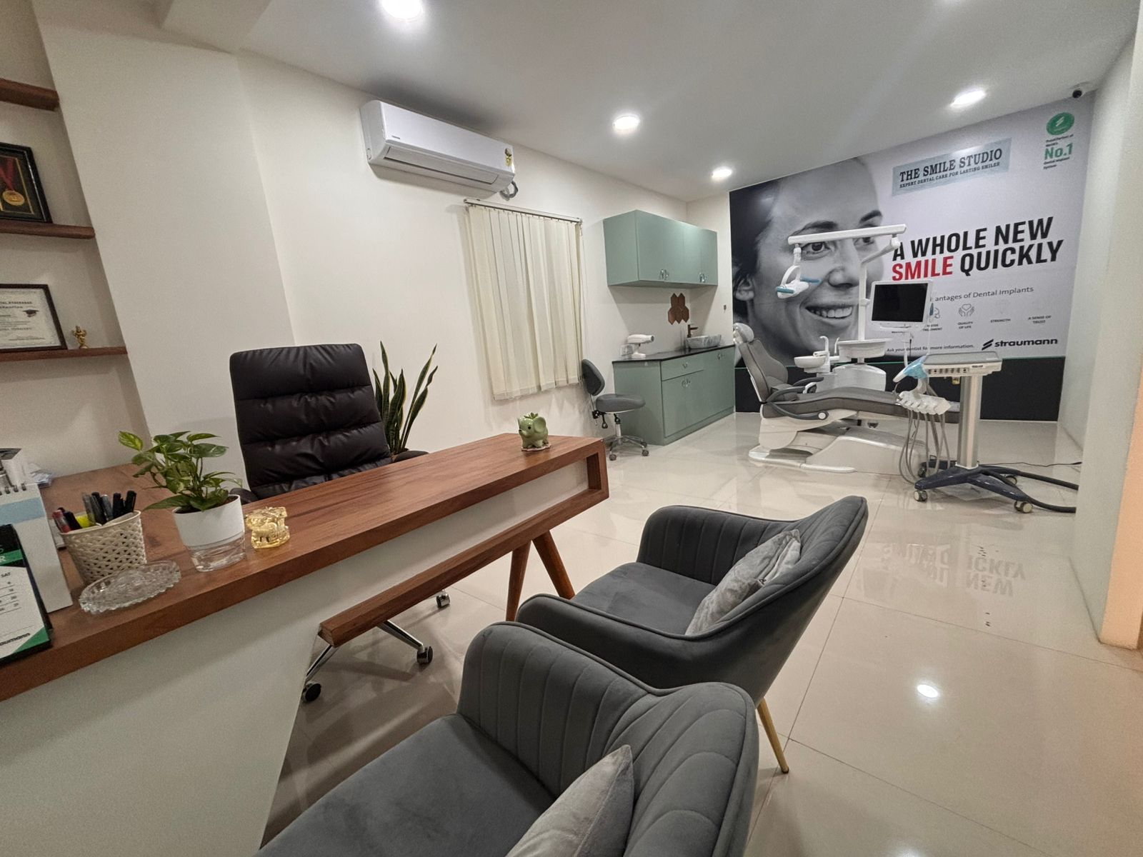 Modern consultation room with dental chair and comfortable seating